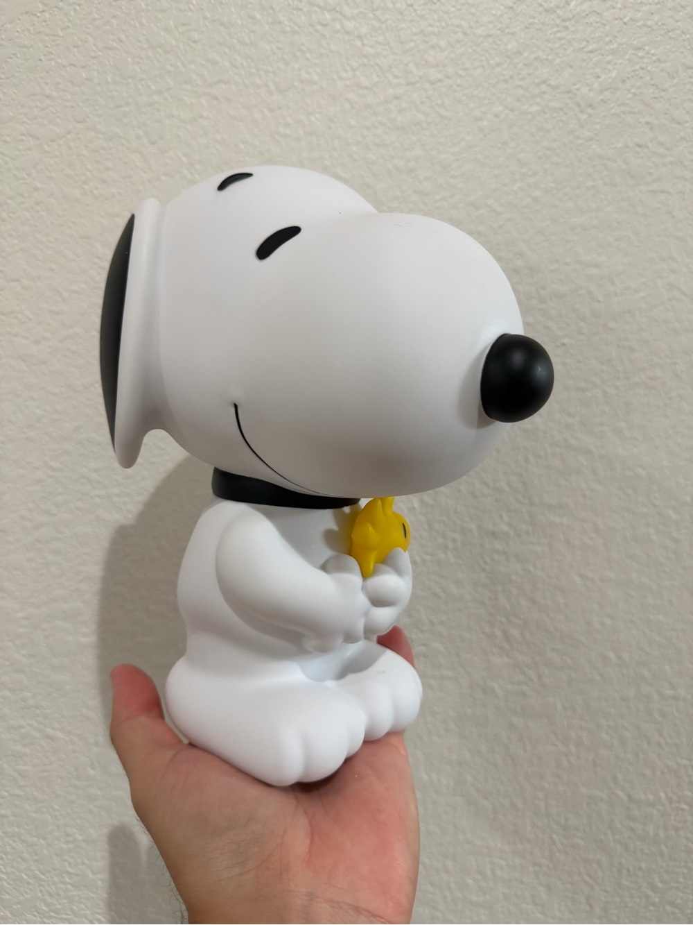 Peanuts Snoopy holding Woodstock piggy bank